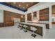 Chef's kitchen featuring a spacious marble island, stainless steel appliances, and custom cabinetry at 49 Crested Cloud Way, Las Vegas, NV 89135