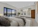This main bedroom has a large window with a pool view and an ornate decor feature at 49 Crested Cloud Way, Las Vegas, NV 89135
