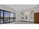 This main bedroom has large windows and views out to the pool area at 49 Crested Cloud Way, Las Vegas, NV 89135