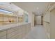 This spacious walk-in closet features ample storage and an island at 49 Crested Cloud Way, Las Vegas, NV 89135