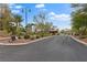 Inviting entrance to a gated community featuring meticulously landscaped grounds and a secure access point for residents at 5205 Sandy Cactus Ln, Las Vegas, NV 89149