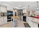 Bright, updated kitchen with stainless appliances, white cabinets, and modern finishes at 5205 Sandy Cactus Ln, Las Vegas, NV 89149