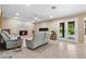 Cozy living room with recliners, a fireplace, and access to the backyard at 5205 Sandy Cactus Ln, Las Vegas, NV 89149