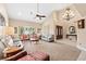 Bright, spacious living room with high ceilings, comfortable seating and neutral color palette for relaxed gatherings at 5205 Sandy Cactus Ln, Las Vegas, NV 89149