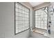 Elegant walk-in shower featuring glass block windows and a tiled bench at 5205 Sandy Cactus Ln, Las Vegas, NV 89149