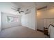 Bright bedroom with carpet, a ceiling fan, and a large window with natural light at 5256 Harvest Breeze Rd, Las Vegas, NV 89118