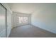 Bedroom features a closet with sliding doors and a window offering natural light at 5256 Harvest Breeze Rd, Las Vegas, NV 89118
