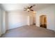 A cozy bedroom includes neutral carpet, a ceiling fan, and a closet with double doors at 5256 Harvest Breeze Rd, Las Vegas, NV 89118