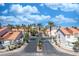Welcoming community entrance with mature palm trees in Villa Pacifica at 5256 Harvest Breeze Rd, Las Vegas, NV 89118