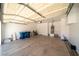 Spacious two car garage with ample room for parking and storage solutions, including attached water heater at 5256 Harvest Breeze Rd, Las Vegas, NV 89118