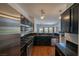 Contemporary kitchen with granite counters, stainless steel appliances, and open layout at 5256 Harvest Breeze Rd, Las Vegas, NV 89118