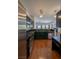 Modern kitchen with stainless steel appliances and granite counters open to the living area at 5256 Harvest Breeze Rd, Las Vegas, NV 89118