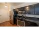 Updated kitchen with stainless steel appliances, granite countertops, and stylish cabinetry at 5256 Harvest Breeze Rd, Las Vegas, NV 89118