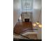 Living room viewed from the staircase, with a fireplace, built-in shelving, and lots of natural light at 5256 Harvest Breeze Rd, Las Vegas, NV 89118