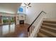 Living room with hardwood floors, a fireplace, sliding glass doors and tall ceilings at 5256 Harvest Breeze Rd, Las Vegas, NV 89118
