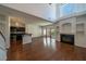 Bright living room with hardwood floors, fireplace, and abundant natural light at 5256 Harvest Breeze Rd, Las Vegas, NV 89118
