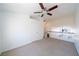 This loft boasts neutral carpet, a ceiling fan, and a view of the home's lower level at 5256 Harvest Breeze Rd, Las Vegas, NV 89118
