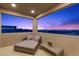 Relaxing balcony with a daybed and comfortable seating, offering stunning panoramic views at 532 Crown Mesa Ave, Las Vegas, NV 89138