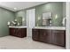 Spacious bathroom with dual vanities, stylish mirrors, and modern sconces at 532 Crown Mesa Ave, Las Vegas, NV 89138