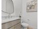 Bright bathroom with marble countertop, modern fixtures, and a decorative mirror at 532 Crown Mesa Ave, Las Vegas, NV 89138