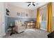 Cozy Bedroom with a crib, comfortable armchair, and cheerful decorations, perfect for a new baby at 532 Crown Mesa Ave, Las Vegas, NV 89138