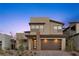 Modern two-story home boasts a finished driveway, manicured yard, and a stylish facade with a two-car garage at 532 Crown Mesa Ave, Las Vegas, NV 89138