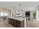Spacious kitchen with an island, stainless steel appliances, and an open view into the living area at 532 Crown Mesa Ave, Las Vegas, NV 89138