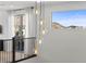 Second-story landing featuring stylish hanging lights and mountain views at 532 Crown Mesa Ave, Las Vegas, NV 89138
