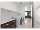 Laundry room with front-load washer/dryer and plenty of counter space for folding at 532 Crown Mesa Ave, Las Vegas, NV 89138