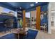 Stylish room with a built in desk area, patio access, and a view to the community area at 532 Crown Mesa Ave, Las Vegas, NV 89138