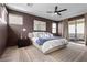 Spacious main bedroom features a plush bed, modern decor, and balcony access for serene living at 532 Crown Mesa Ave, Las Vegas, NV 89138