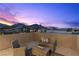 Inviting rooftop patio with stylish wicker furniture and mountain views, perfect for relaxing evenings at 532 Crown Mesa Ave, Las Vegas, NV 89138