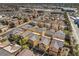 Bird's eye view of the community showing residential homes and nearby businesses at 6217 Red Jamboree Ct, Las Vegas, NV 89130
