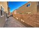 Spacious backyard with brick wall and paved patio for outdoor enjoyment at 6217 Red Jamboree Ct, Las Vegas, NV 89130