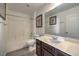 Bathroom showcasing a shower-tub, toilet, and vanity with framed mirror and decor at 6217 Red Jamboree Ct, Las Vegas, NV 89130