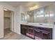 Bathroom features a dual sink vanity and a large mirror at 6217 Red Jamboree Ct, Las Vegas, NV 89130