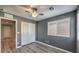 Cozy bedroom featuring a ceiling fan, wood floors, window with blinds, and closet at 6217 Red Jamboree Ct, Las Vegas, NV 89130