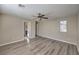 Spacious bedroom features a ceiling fan and wood-look flooring at 6217 Red Jamboree Ct, Las Vegas, NV 89130