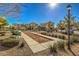 A well-maintained community space, with seating, greenery and bocce ball court at 6217 Red Jamboree Ct, Las Vegas, NV 89130