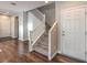 Bright entryway with hardwood floors leading to the staircase and adjacent living space at 6217 Red Jamboree Ct, Las Vegas, NV 89130