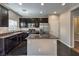 Contemporary kitchen with stainless steel appliances and dark granite countertops at 6217 Red Jamboree Ct, Las Vegas, NV 89130