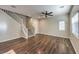 Hardwood floors, neutral paint, and natural light in this open concept living area and staircase at 6217 Red Jamboree Ct, Las Vegas, NV 89130