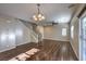 Spacious living area with modern ceiling fan and natural light from sliding glass door at 6217 Red Jamboree Ct, Las Vegas, NV 89130