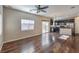 Open-concept living area with hardwood floors, ceiling fan and natural light at 6217 Red Jamboree Ct, Las Vegas, NV 89130