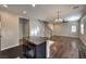 Open concept living space with kitchen island, staircase, and plenty of natural light at 6217 Red Jamboree Ct, Las Vegas, NV 89130