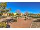 Community playground featuring multiple pieces of equipment and landscaped areas at 6217 Red Jamboree Ct, Las Vegas, NV 89130