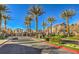 Beautiful street with palm trees lining the walkway to residential houses at 6217 Red Jamboree Ct, Las Vegas, NV 89130