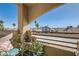 Relaxing balcony with outdoor seating and peaceful views of the neighborhood at 6883 Tamarus St # 203, Las Vegas, NV 89119
