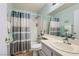 Clean bathroom featuring a shower, bathtub, and well-maintained vanity at 6883 Tamarus St # 203, Las Vegas, NV 89119