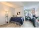 Guest bedroom featuring laminate floors, closet, and plenty of natural light at 6883 Tamarus St # 203, Las Vegas, NV 89119